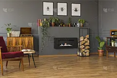 壁炉旁边的柴火海报在灰色的公寓室内与红色的扶手椅。真实的照片