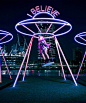 light-emitting retro swings by ENESS invite us to ponder the big questions of life