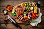 General 2000x1333 still life food meat flesh cow animals death cutting board table knife fork rosemary parsley salt mushroom tomatoes red onion chilli peppers Pepper Garlic corn zucchini Leek beans napkin wooden surface