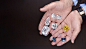Laurence-Graff-holding-nine-of-the-worlds-largest-and-rarest-diamonds-in-two-hands