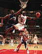 The Chicago Bulls' Michael Jordan goes up and under Utah Jazz forward Karl Malone as he drives to the hoop during the third quarter of Game 2 in the NBA Finals on June 4, 1997, in Chicago. (Tribune file photo)