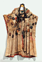West African cloak with amulets