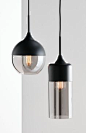 The Beacon Lighting Lunar 1 light round pendant in black with smoke glass.