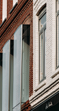 UNStudio's 'looking glass' façade in amsterdam mimics billowing fabric :  