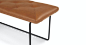 Level Bella Caramel 61" Bench : A fine balance. The Level bench features fine details such as its unique, powder-coated legs, and smoothly tufted leather top. The lightly padded bench makes the Level a great place to take a load off at the end of a l