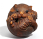 Netsuke LARGE RAT, ITS LONG TAIL WRAPPED AROUND THE BODY. SIGN.: MASANAO. Second half of the 19th century.