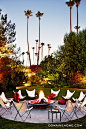 Get the Look: The Parker Hotel’s Lush Landscape // Palm Springs, fire pit, butterfly chairs, palm trees