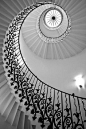 A black-and-white photograph of the staircase at the Queen's House, Greenwich. Patrick Baty (on Pinterest) was involved in its restoration.
