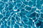 Wavy water surface in a swimming pool, wave, abstract, background, sunny, reflection, blue