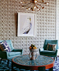 Jonathan Adler's textured feature wall.  Love the aqua chairs.: 