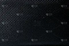 网状黑色纹理。深色聚酯纤维材料，用于运动布或抽象性织物背景。合成图案的背包和运动器材。