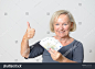 stock-photo-close-up-adult-blond-woman-holding-fan-of-five-euro-banknotes-while-showing-thumbs-up-hand-sign-at-283633229.jpg (1500×1093)