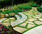 Photo of a mediterranean sloped garden in San Diego with natural stone paving.
