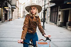 Girl on bicycleYoung woman cycling in the city