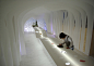 Kotaro Horiuchi creates a Paper Cave inside his architecture studio : Japanese architect Kotaro Horiuchi has created a white cave-like space in his office by hanging sheets of glass fibre paper from the ceiling.
