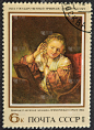 描绘女孩戴耳环的老式邮票。鲁本斯。