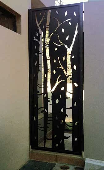 Birch tree design - security gate. At least somebody put a little ...