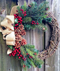 Winter wreath or Christmas wreath using grapevine, red berries, pine, and pine cones with a tan burlap-look bow. on Etsy, $65.00:: 