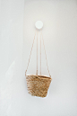 brown wicker basket on white wall