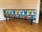 SOLD**** Upcycled retro sideboard : This piece has been painted black in scuff resistant paint, the front has been decoupaged in a quirky and colourful dog fabric, the whole piece has been sealed for wear and durability.  Height 73cm Depth 41cm Width 152c