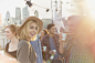 Portrait smiling young woman drinking beer at rooftop party by Caia Images on 500px