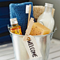 Greet weekend guests with your very own room service. Provision a bucket with overnight essentials for a boutique hotel touch.: 
