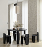 Modern Contemporary Black Round Dining Table in an Eclectic Chic Dining Room Design.jpg