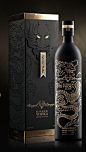 A matt black finish, and a delicate, gold line drawing add a touch of class to this matching box and bottle design: 