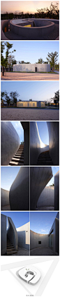 Spiral Art gallery,位于上海嘉定新城区天祝路，由“大舍建筑”设计。250平方米的艺术廊采用螺旋的方式将观者引入地下私密的内部空间。被有意拉长的流线在开放与封闭的交替节奏中让人产生游弋的愉悦。设计师通过抽象的建筑表现了一种原始园林的神秘感。