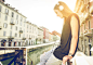 woman listening to music with headset and smartphone in Milan - stock photo