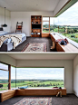 In this modern bedroom, a large window perfectly frames the view, while a wood bench has been built to create a space to sit and relax. #BedroomDesign #Window#WoodBench