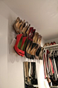 Crown Molding Shoe Shelves- perfect space saver storage. 8' base pine base molding and 8' crown molding + white spray paint. Wood glue crown on to base molding, finish nail to hold in place while drying, spray paint, install w/ 2 screws onto wall studs.