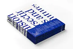 This may contain: a stack of blue and white books sitting on top of each other