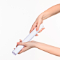 white-cylinder-props-female-hands-white-background_155003-20493