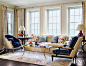 Traditional Yellow Living Room with Brick Fireplace : The light-filled living room of this Lake Forest home features a Holly Hunt sofa and a pair of chairs by Dessin Fournir swathed in Raoul Textiles fabric.