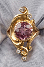Art Nouveau 14kt Gold, Pink Tourmaline, and Diamond Ring, bezel-set with a circular-cut pink tourmaline measuring approx. 9.50 x 5.40 mm, in a scrolling mount with old European-cut diamond melee accents