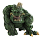 This may contain: a statue of a green monster with horns and claws on it's head, sitting down