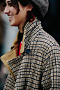 Woman wearing check coat