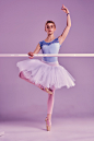 Classic ballerina posing at ballet barre Free Photo