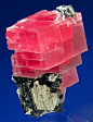 Rhodochrosite atop a large Pyrite with Tetrahedrite and Quartz... by Kevin Ward