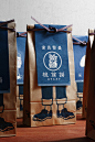 NOSIGNER - Anything : NOSIGNER designed the package of "Anything," the brand of traditional-Japanese-style aprons. The paper bag, originally used for rice, illustrated with the apron provides an actual image of how to wear it and its lineup.