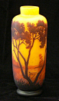 Amber and yellow tree cameo glass vase.