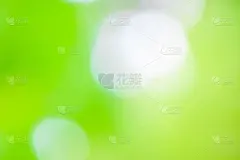 抽象模糊灯光梯度的绿色和散景壁纸背景。