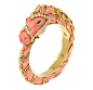 A Carved Coral, Coral and Emerald Horse Bangle Bracelet, by Van Cleef 