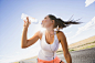 Caucasian runner drinking water bottle on remote road by Gable Denims on 500px