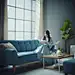 ls7623_An_Asian_woman_sitting_on_a_sofa_reading_a_bookBlack_sha_bf91d8b5-bdd1-444d-ac16-029c77f8c268