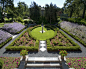 This is an example of a large classic back formal partial sun garden in Other with gravel.