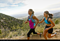 Hispanic women running in remote area - stock photo