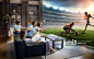 Family with children watching American football game on TV_创意图片