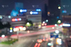城市灯光夜景模糊散景，抽象背景。(韩国釜山海云台海滩)